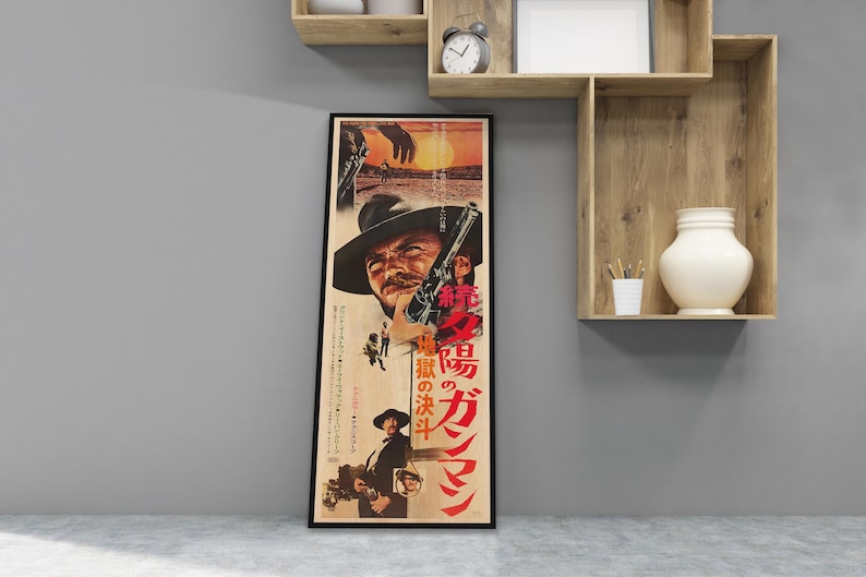 a framed poster of a man with a gun, displayed on a wall in a room with shelves and a vase.
