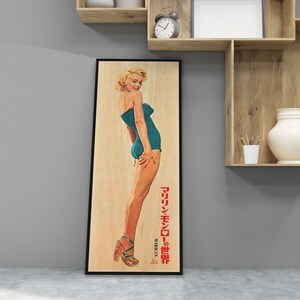 a picture of a woman in a bathing suit hanging on a wall