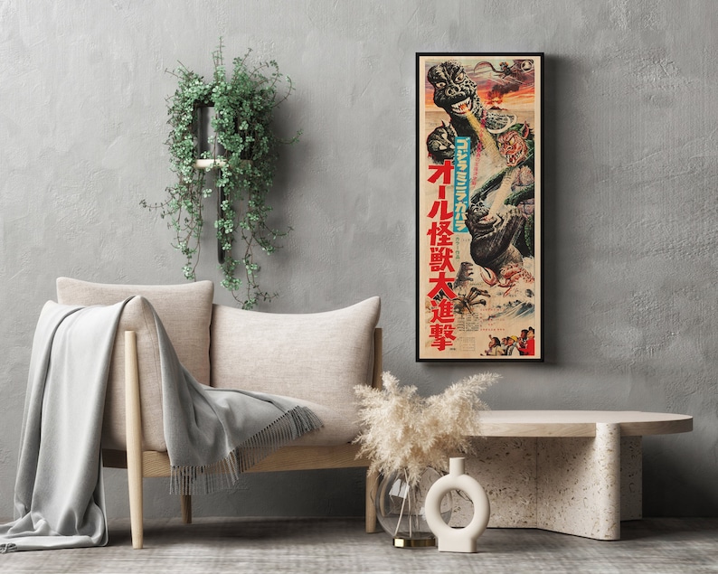 a living room with a couch and a poster on the wall