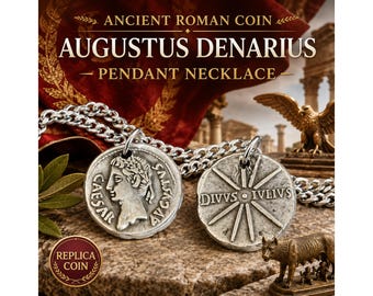 May include: A silver-toned pendant necklace featuring two replica ancient Roman coins. One coin displays a profile of Caesar Augustus with the text CAESAR AVGVSTVS, while the other shows a starburst design with the text DIVVS IVLIVS. The coins are attached to a silver-colored metal chain.