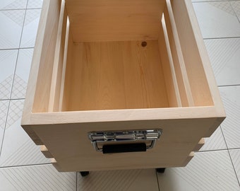 Deluxe Oversized Wooden Crate or Box made of natural wood on castor wheels with spring loaded pull handles with rubber grips.