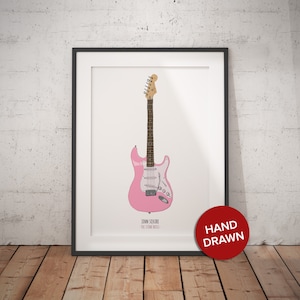 May include: A hand-drawn illustration of a pink electric guitar with a white pickguard. The guitar is labelled "John Squire - The Stone Roses".