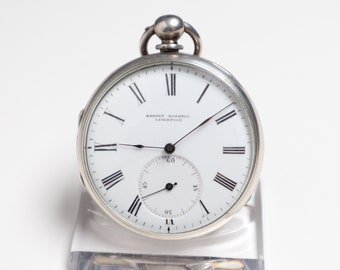 May include: Silver pocket watch with Roman numeral markings on the face. The watch face reads "Robert Bomwell, Liverpool".