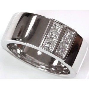 May include: A silver band ring with two rows of square-cut diamonds set in a channel setting.
