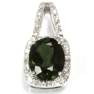 May include: A silver pendant with a large, oval-shaped green gemstone surrounded by a halo of smaller diamonds.