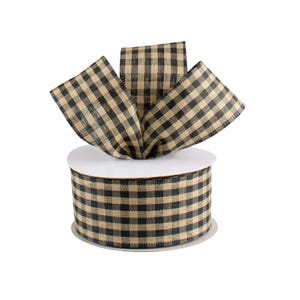 May include: A roll of decorative ribbon with a black and tan checkered pattern. The ribbon is arranged in a bow shape on top of the roll. The ribbon is made of a textured material.