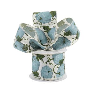 May include: A roll of white and blue ribbon with a pumpkin pattern. The ribbon is 2.5 inches wide and has a wired edge.