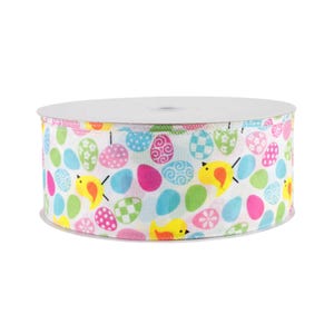 May include: A roll of white ribbon with a colorful Easter egg and chick pattern. The ribbon is 2.5 inches wide and features a variety of pastel colors, including pink, blue, green, and yellow.
