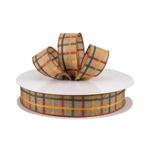 May include: A roll of brown, yellow, green, and orange plaid ribbon with a bow tied on top.