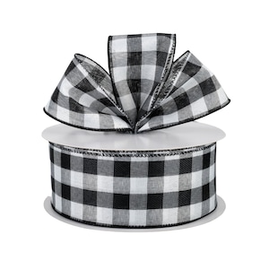 May include: A spool of black and white gingham ribbon with a bow tied on top. The ribbon is 2.5 inches wide.
