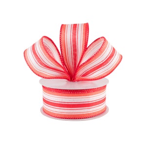 May include: A spool of red and white striped ribbon with a bow tied on top. The ribbon is 2.5 inches wide.