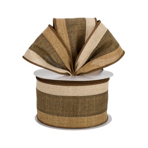 May include: A roll of brown, beige, and cream striped wired ribbon with a brown edge. The ribbon is on a white spool.