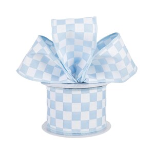 May include: A spool of light blue and white checkered ribbon. The ribbon is arranged in a decorative bow on top of the spool. The ribbon is made of a fabric material and is suitable for crafts and gift wrapping.