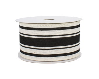 May include: A spool of black and white striped ribbon. The ribbon is made of a woven fabric and has a subtle texture.