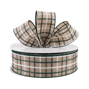 May include: A roll of brown and green plaid ribbon with white accents. The ribbon is wrapped around a white spool.