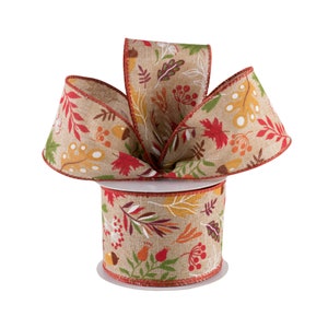May include: A roll of brown burlap ribbon with a fall-themed print of leaves, acorns, and berries in shades of red, orange, yellow, and green.