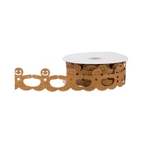 May include: A spool of brown felt ribbon featuring a repeating die-cut pattern of gingerbread people holding hands. Each figure has a simple smiling face and circular buttons, with the ribbon wound around a white circular cardboard core.
