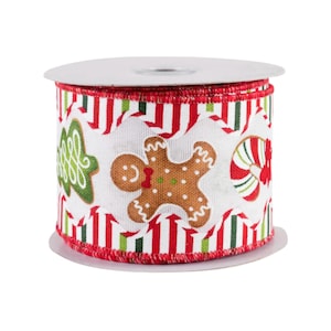 May include: A roll of Christmas-themed ribbon featuring a white background with red and green vertical stripes. The ribbon is decorated with gingerbread men, candy canes, and Christmas tree designs. The edges are trimmed with red stitching.