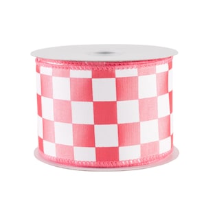 May include: A spool of decorative ribbon featuring a red and white checkered pattern. The ribbon is a wide, sturdy material, perfect for crafting or gift wrapping. The spool has a white core and a pink edge.
