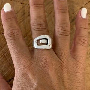 Bold, chunky, silver adjustable ring—perfect for birthdays. statement jewelry, a stylish silver gift for a friend or mom. on trend