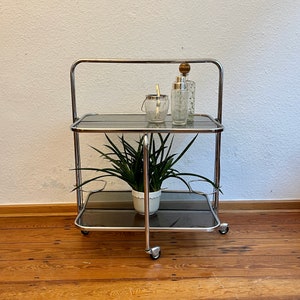 1970s chrome dinette/serving trolley with glass trays.
