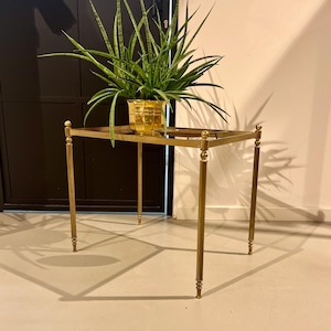 Golden 70s side table made of brass.