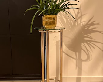 70s golden flower stool with a glass tray.