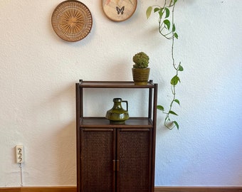 Bamboo shelf with two cupboard compartments.