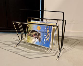 Mid-century 1950s gold newspaper rack.