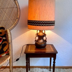 70s table lamp with a ceramic base.