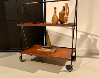 70s dinette/serving trolley with a black frame of teak trays.