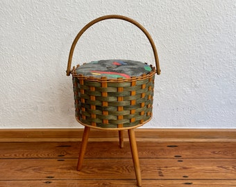 Beautiful Mid Century 50s/60s sewing basket made from rattan on wooden legs.