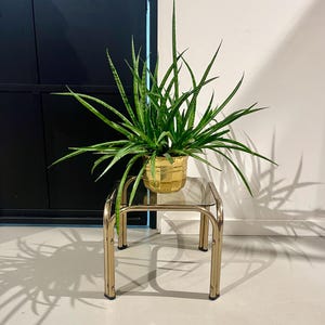 80s side table with a chrome frame.