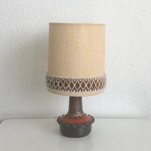 70s table lamp with a ceramic base.
