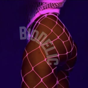 May include: A close-up of a person wearing a neon pink fishnet bodysuit. The bodysuit has a diamond pattern and the text "BIODELIC" is visible. The background is dark purple.