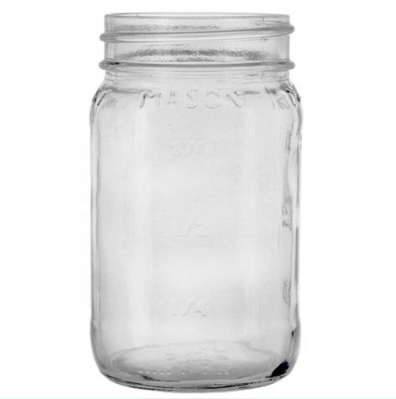 May include: A clear glass mason jar with a threaded top opening. The exterior surface features embossed text reading MASON, along with measurement markings for 1/2 and 1/4, providing a transparent view through the cylindrical container body.