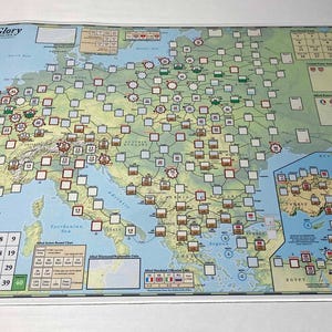 May include: A board game titled "Paths of Glory" featuring a map of Europe and the Middle East. The game board is filled with various markers and symbols, with a white border. The game board has a light blue and green color scheme.