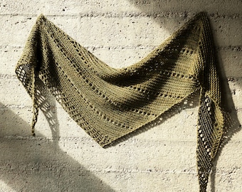 May include: A triangular knit shawl in a muted olive green color. The textile features a combination of solid garter stitch sections and openwork lace bands with elongated eyelet patterns, creating a textured, lightweight, and airy appearance.