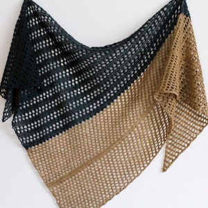 May include: A black and brown crocheted shawl with a triangular shape. The shawl is made of a lightweight, open-weave fabric.