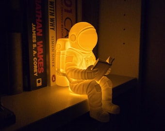 Glowing Astronaut Bookshelf Ornament - Sci-Fi Decor for Book Lovers - Cozy Reading Nook Gift