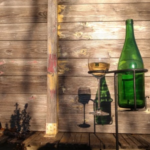 Combined glass holder and bottle holder for the garden