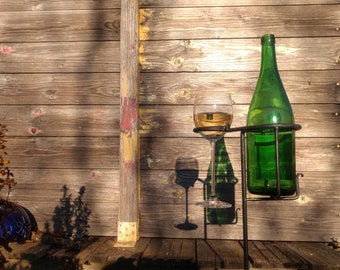 Combined glass holder and bottle holder for the garden