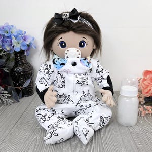 Cloth baby doll dark brown hair blue eyes