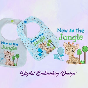 May include: Two blue baby bibs with brown polka dots and a cute giraffe design. The bibs have the text "New to the Jungle" embroidered on them.