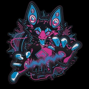 May include: A black sticker featuring a stylized, anthropomorphic creature with a pink and blue color scheme. The creature has large ears, multiple eyes, and is surrounded by graphic elements. The design includes the text "ACME".