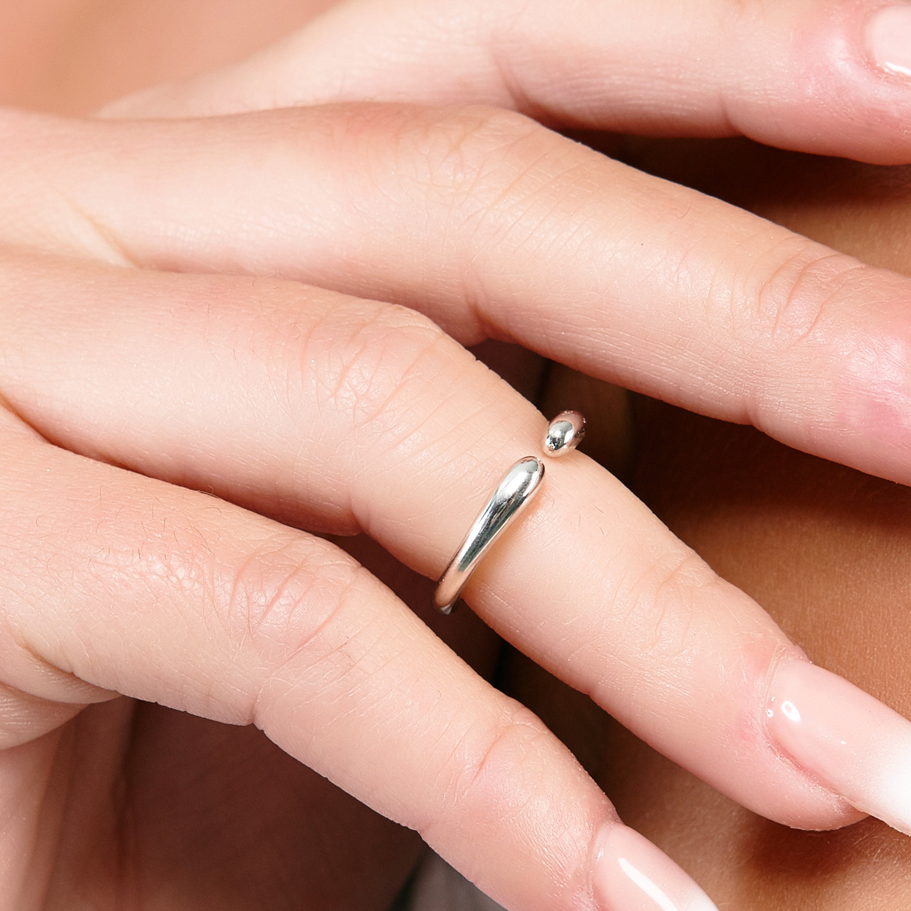 Silver ring in small finger deals