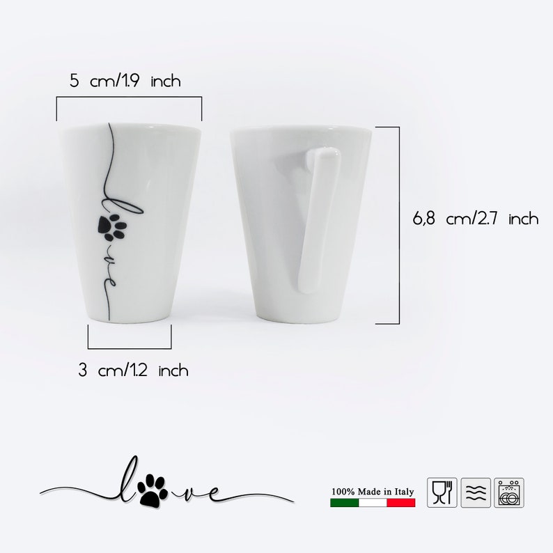 Puede incluir: Taza de caf&eacute; de cer&aacute;mica blanca con una huella de pata negra y la palabra "love" escrita en el lateral. La taza mide 6,8 cm de alto y 3 cm de ancho. Est&aacute; hecha en Italia.