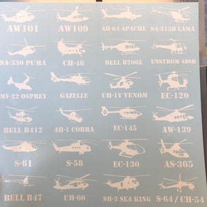 Puede incluir: Una hoja de calcomanías de helicópteros blancos con varios modelos, incluyendo AW101, AH-64 APACHE, SA-330 PUMA, MV-22 OSPREY, BELL B412, S-61, BELL B47, AW109, SA-315B LAMA, CH-46, GAZELLE, UH-1Y VENOM, EC-145, S-58, UH-60, BELL B206L, ENSTROM 480B, EC-120, AW-139, EC-130, AS-365, SH-3 SEA KING y S-64/CH-54.