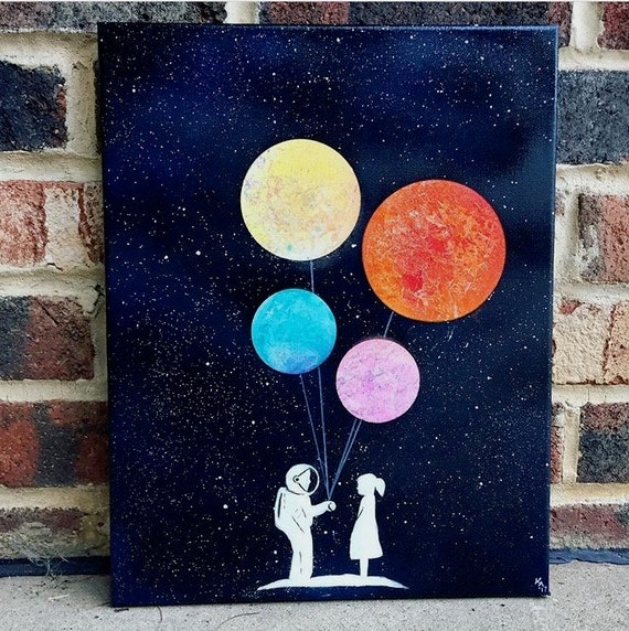 astronaut spray painting canvas