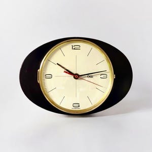 Zeldzame vintage wandklok van zwart formica en messing - Retro mechanische klok uit het midden van de eeuw, jaren 1950, 1960 door ODO France